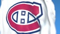 Waving flag with Montreal Canadiens NHL hockey team logo, close-up. Editorial 3D rendering