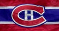 A waving flag of the Montreal Canadiens, a professional ice hockey team competing in the National Hockey League.