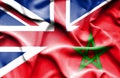 Waving flag of Morocco and Great Britain