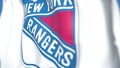 Waving flag with New York Rangers NHL hockey team logo, close-up. Editorial 3D rendering