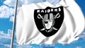 Waving flag with Oakland Raiders professional team logo. Editorial 3D rendering