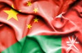 Waving flag of Oman and China