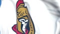 Waving flag with Ottawa Senators NHL hockey team logo, close-up. Editorial 3D rendering