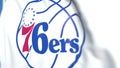 Flying flag with Philadelphia 76Ers team logo, close-up. Editorial 3D rendering