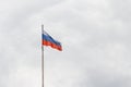 Flag of Russia against gloomy cloudy sky Royalty Free Stock Photo