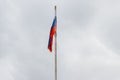 Waving flag of Russia against cloudy sky Royalty Free Stock Photo