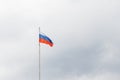 Waving flag of Russia against gloomy cloudy sky Royalty Free Stock Photo