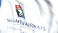 Waving flag with South African Airways logo, close-up. Editorial 3D rendering