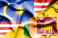 Waving flag of Sri Lanka and Malaysia