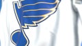 Waving flag with St. Louis Blues NHL hockey team logo, close-up. Editorial 3D rendering