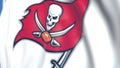 Flying flag with Tampa Bay Buccaneers team logo, close-up. Editorial loopable 3D animation