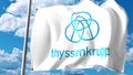 Waving flag with ThyssenKrupp logo against clouds and sky. Editorial 3D rendering