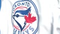 Waving flag with Toronto Blue Jays team logo, close-up. Editorial 3D rendering