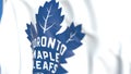 Waving flag with Toronto Maple Leafs NHL hockey team logo, close-up. Editorial 3D rendering Royalty Free Stock Photo