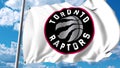 Waving flag with Toronto Raptors professional team logo. Editorial 3D rendering Royalty Free Stock Photo