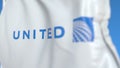 Waving flag with United Continental Holdings logo, close-up. Editorial 3D rendering