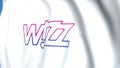 Waving flag with Wizz Air logo, close-up. Editorial loopable 3D animation