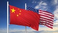 Waving flags of China and USA on flagpole Royalty Free Stock Photo
