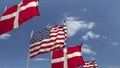 Waving flags of Denmark and the USA on sky background, 3D rendering