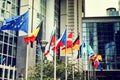 Waving flags in front of European Parliament building in Brussel Royalty Free Stock Photo