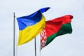 Waving flags of Ukraine and Belarus