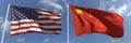 Waving flags of the USA and China on flagpoles, 3d rendering Royalty Free Stock Photo