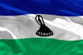 Waving Lesotho flag for using as texture or background, the flag is fluttering on the wind