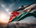 Waving Palestinian flag in dramatic sunset sky with selective focus and motion blur, symbolizing resilience and identity Royalty Free Stock Photo