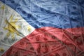 Waving philippines flag on a american dollar money background Royalty Free Stock Photo