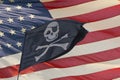 Waving pirate flag jolly roger on usa star and stripes Royalty Free Stock Photo