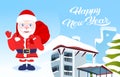 Waving santa chaus hold present sack happy new year merry christmas holidays concept winter snow covered house cityscape Royalty Free Stock Photo