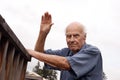 Waving Senior Neighbor Outdoors Royalty Free Stock Photo