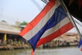 Waving Thailand flag at outdoor with water market