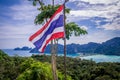 Waving Thailand flag at PhiPhi Island viewpoint