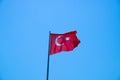 Waving Turkish flag against the blue sky Royalty Free Stock Photo