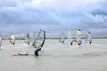 Waving wind surfer racing in the Atlantic storm winds