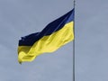 waving in the wind yellow-blue flag of Ukraine against the sky Royalty Free Stock Photo