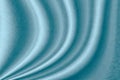 Wavy blue fabric texture surface curtain wave with a pattern background. macro texture of blue striped fabric Royalty Free Stock Photo