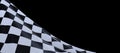 Wavy checkered flag under the lights isolated on a black background