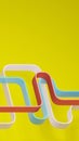 Wavy colorful curves over yellow background. Abstract design, digtal 3D render. Royalty Free Stock Photo