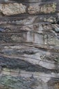 Wavy gray rock and mortar layers