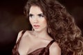 Wavy Hair. Beautiful Fashion Brunette Woman. Healthy Long Brown Royalty Free Stock Photo