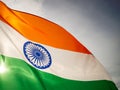 The wavy Indian flag on the sunset sky. Indian independence day. Royalty Free Stock Photo