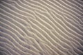 Wavy lines pattern on sand of dunes on beach Royalty Free Stock Photo