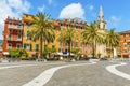 Wavy paving draws you towards the church and colourful buildings in the central square in Lerici, Italy