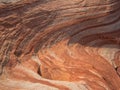 Wavy rocks with lines and traces in the sand