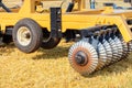 Wavy shaped disc harrow for field work on an agricultural tractor on a sunny day Royalty Free Stock Photo