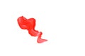 A wavy smear of coral paint is insulated on a white background Royalty Free Stock Photo