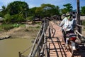 Crossing the wooden bridge. Waw. Bago region. Myanmar Royalty Free Stock Photo