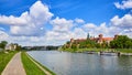 Wawel castle - famous landmark in Krakow Poland. Picturesque landscape on coast Vistula river during the sunny day Royalty Free Stock Photo